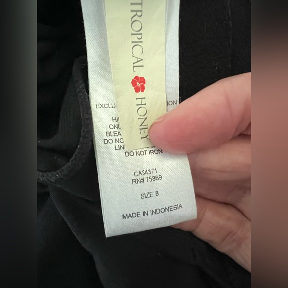 Black and leopard one piece swimsuit. Cross tie sash.  Worn once. Fits like a 6 - Picture 7 of 7